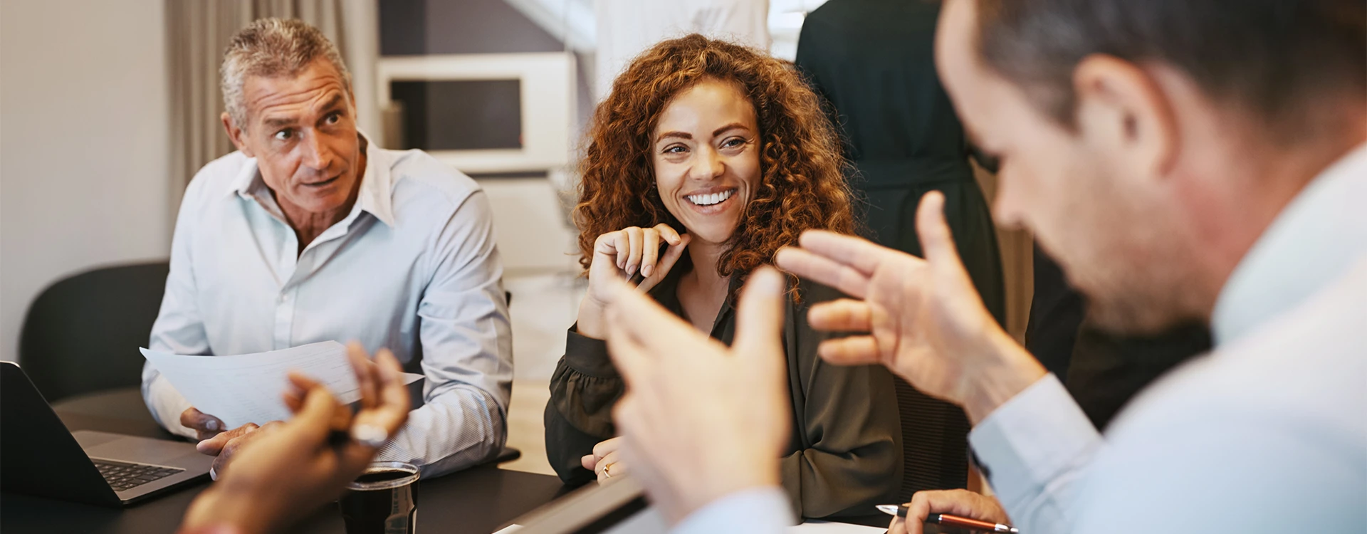 A Mechanical and Electrical Consultant Reviewing A Survey With Management Team.